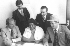 Candidates of the 1979 Ownership Campaign (l to r, Jim Burch, Ennis Francis, Tommy Kersey; standing right, Norman Kurland) with OC Campaign Advisor Lui Granados. Interview by the Manchester Union Leader.