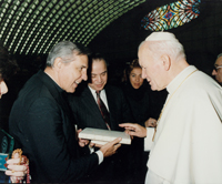 Pope John Paul II receives Curing World Poverty book